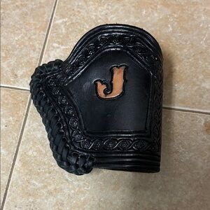 Black leather derringer holder. J initial. Made by Poncho Vega, Tombstone, AZ